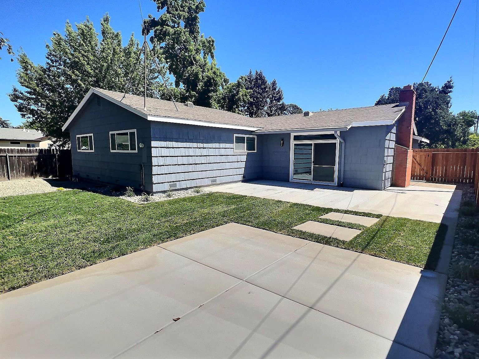 Rear exterior, lawn and patio