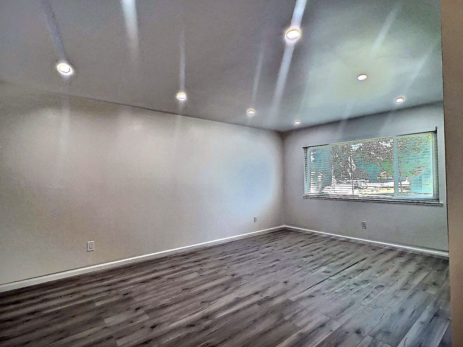 Bright bedroom with updated flooring