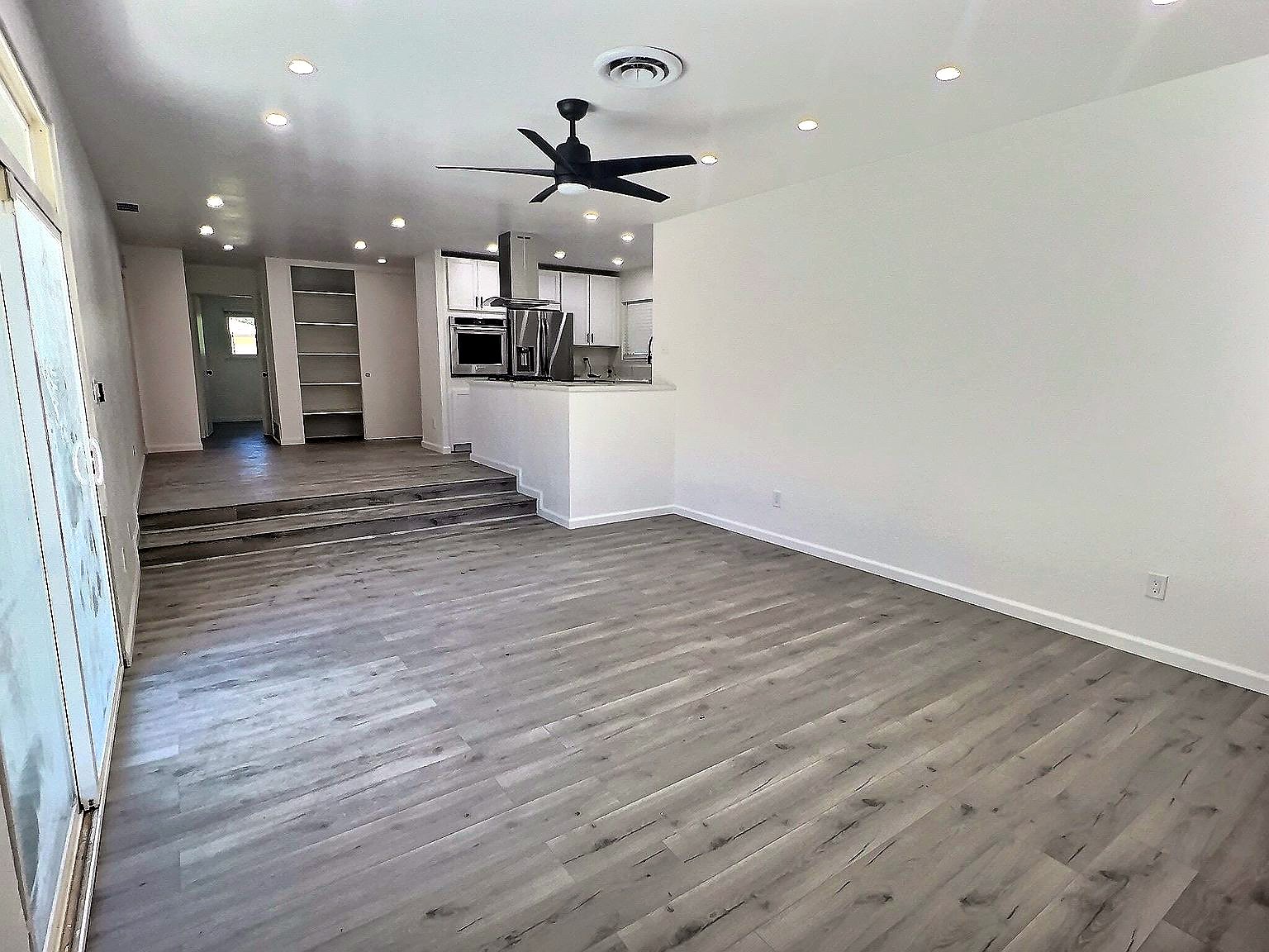 Open-plan living area looking toward the kitchen